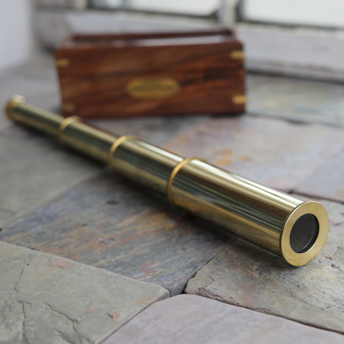 At Auction: early 1900's brass telescope w/ working wooden legs
